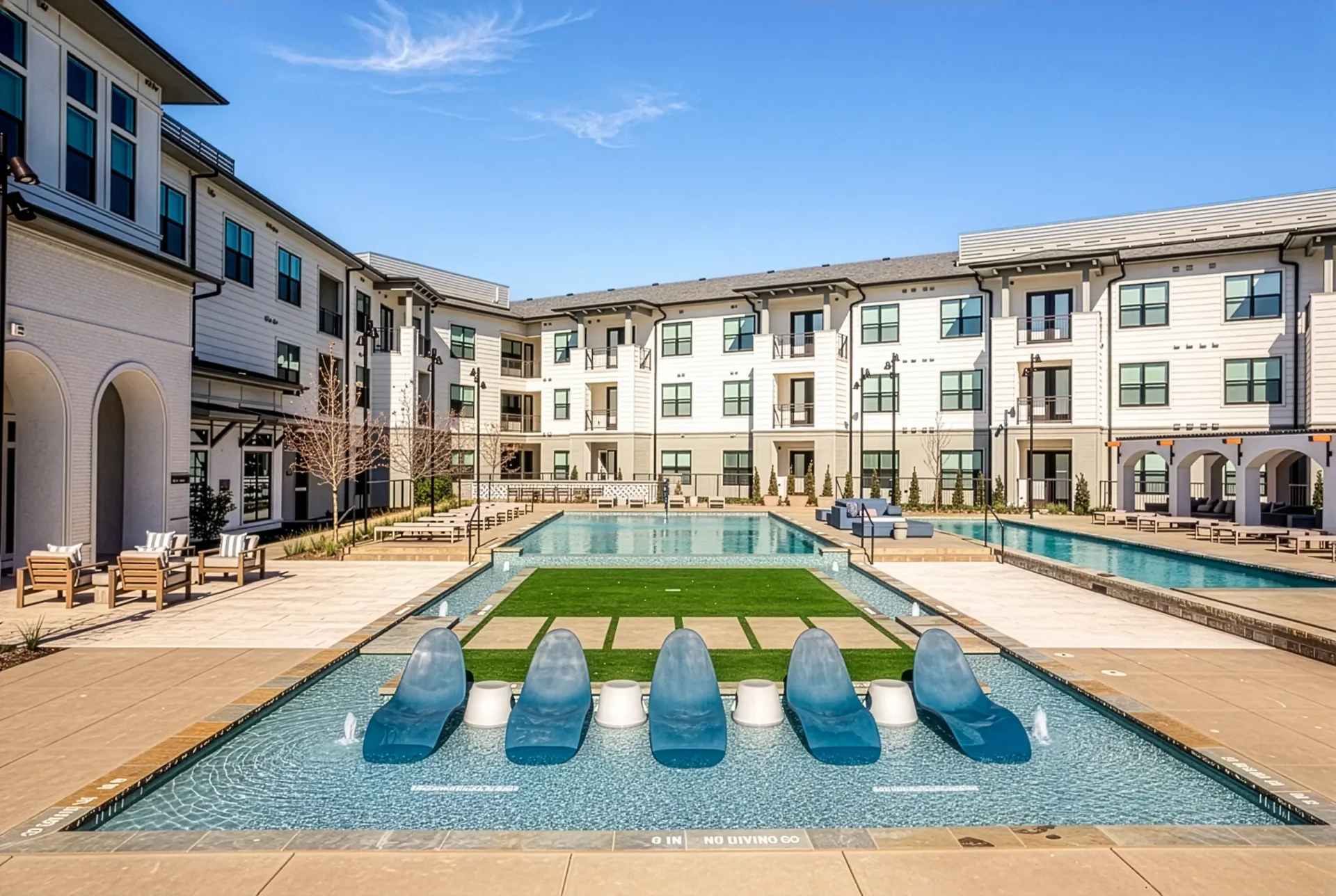 Resort-style pool courtyard with in-water loungers at Parker at Walsh apartments in Aledo, TX